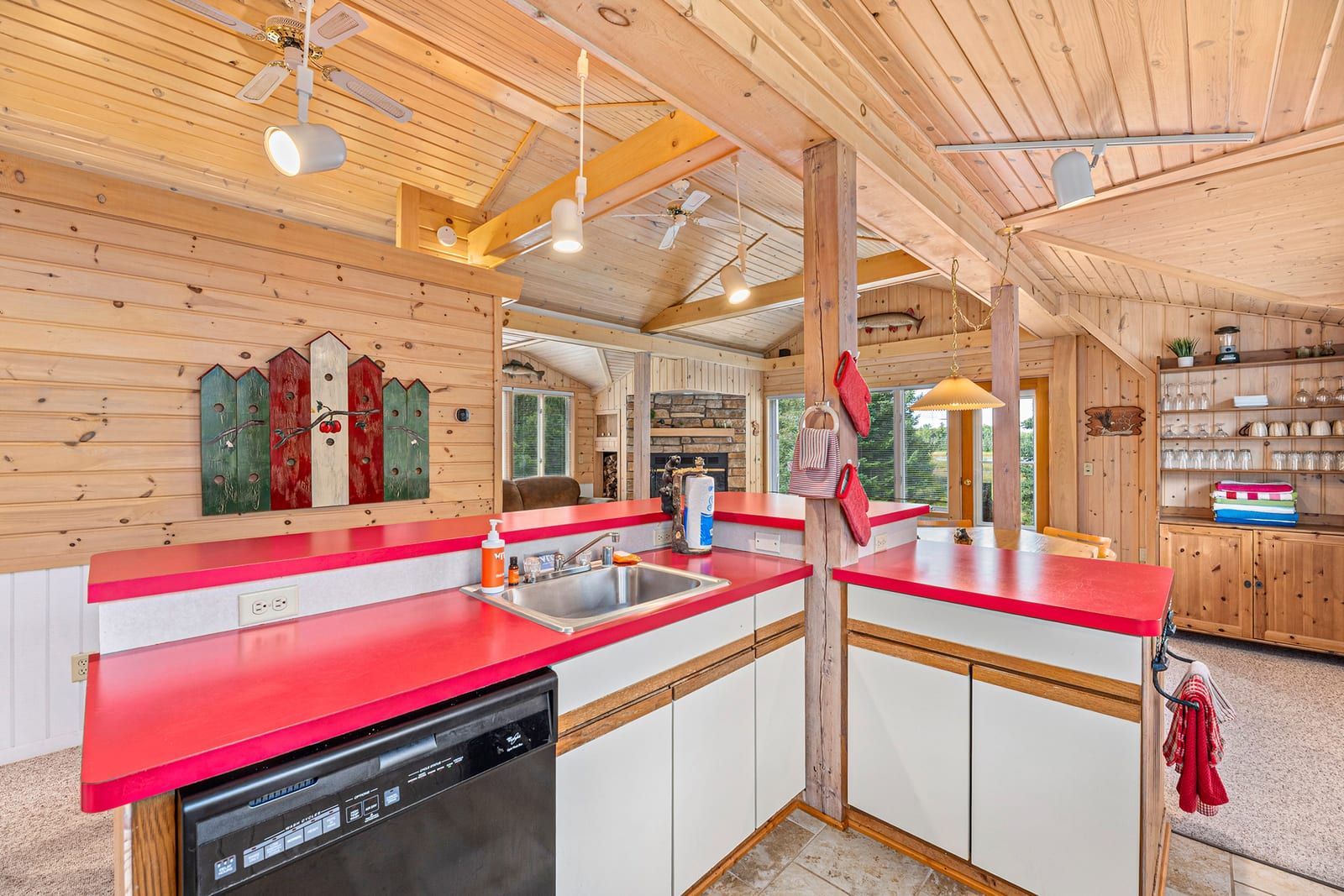 Kitchen with red countertops and pine wood interior