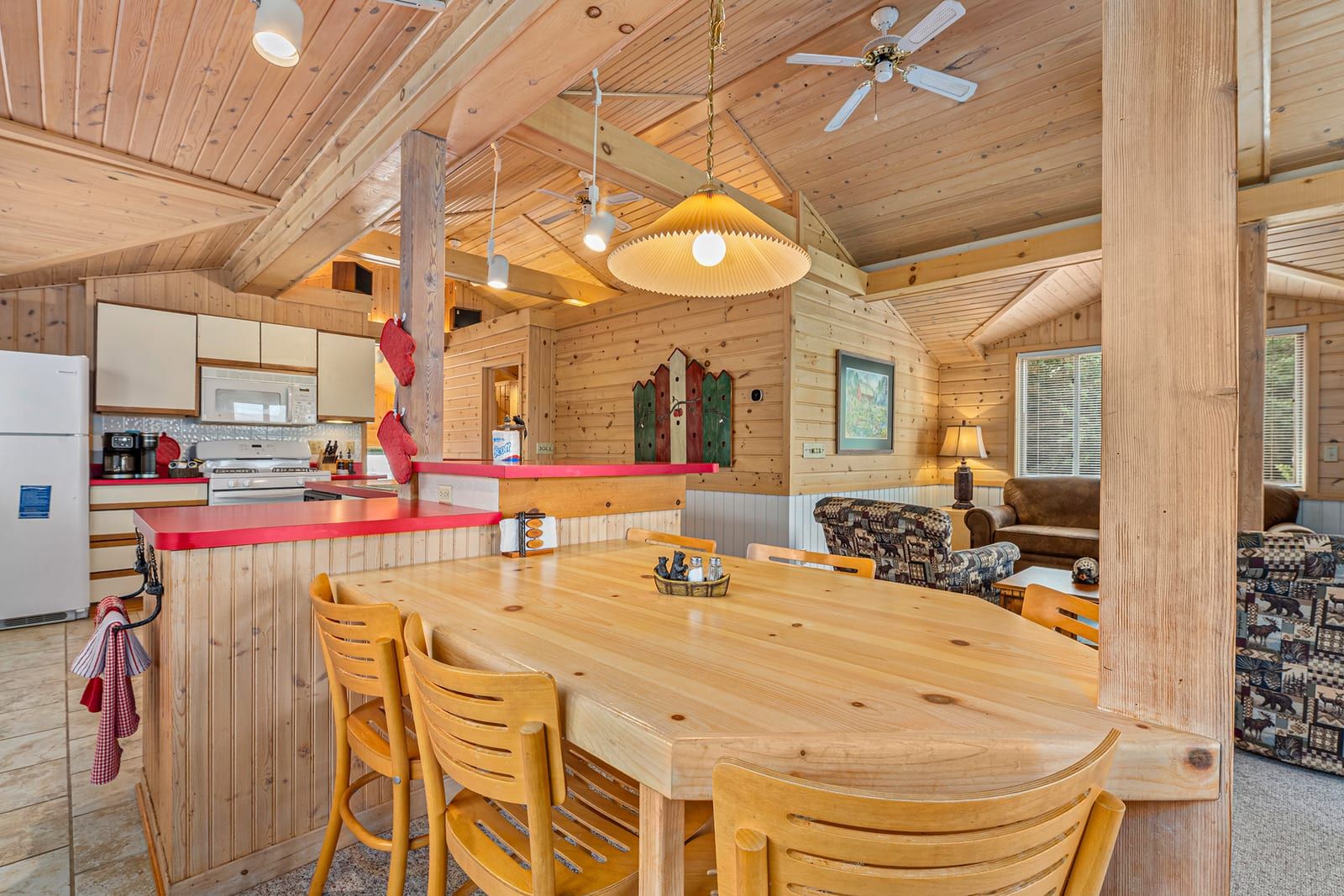 Dining area and kitchen bar with wooden stools
