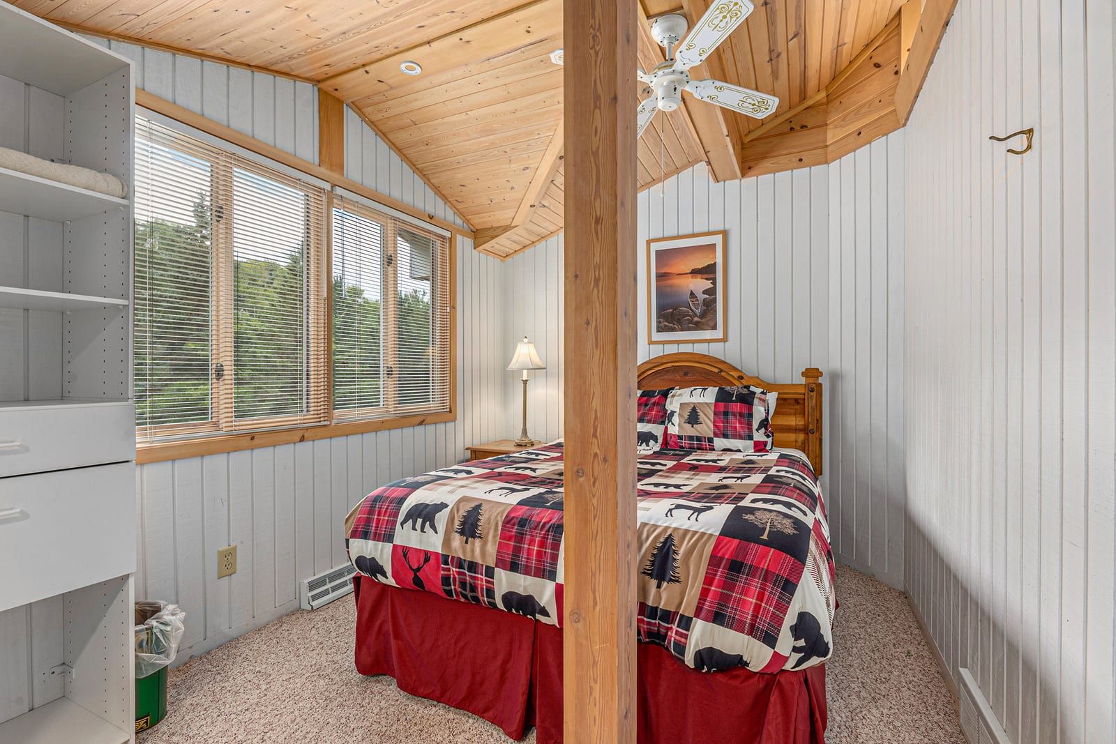 Upper bedroom with queen bed and vaulted ceiling