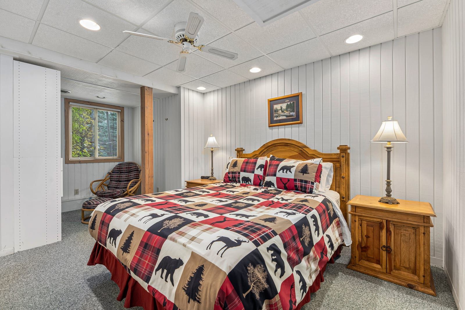 Lower level bedroom with queen bed and Northwoods comforter